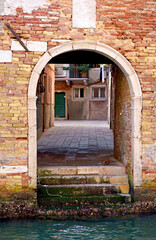 VENICE, ITALY - September 29, 2023: doors in Venice. Architecture. Wooden door and window, building exterior in Venice, exterior design