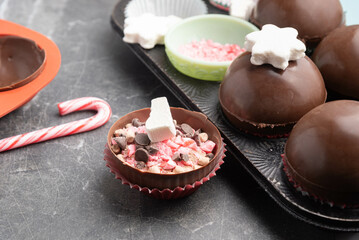 Making giftable peppermint mocha hot chocolate bombs.