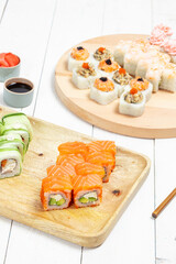 Traditional delicious fresh sushi set isolated on white background. Sushi menu. Asian food