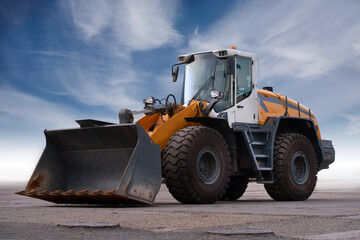 Heavy construction equipment. Large wheeled tractor with bucket