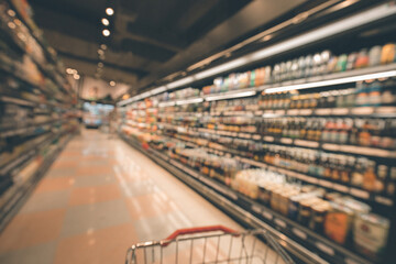 Defocused blur of supermarket shelves with alcohol products - obrazy, fototapety, plakaty