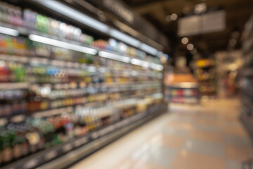Defocused blur of supermarket shelves with alcohol products