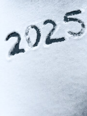 Date 2025 written on white texture snow