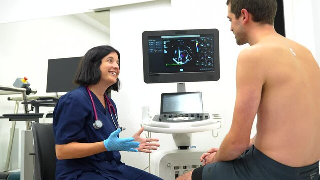 Cardiologist explaining the results of an echocardiogram to a patient