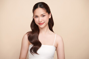 Obraz premium Beautiful young asian woman with clean fresh skin on beige background, Face care, Facial treatment, Cosmetology, beauty and spa, Asian women portrait.