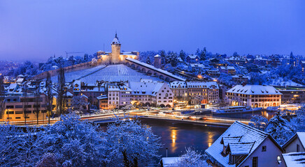 Twilight scene of the medieval fort and landmark of Swiss town Schaffhausen Munot with fresh snow...