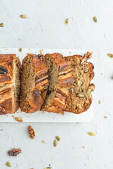 Banana bread on a light background. Homemade cakes with banana and nuts.