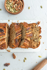 Banana bread on a light background. Homemade cakes with banana and nuts.
