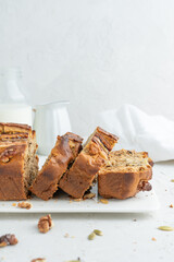Banana bread on a light background. Homemade cakes with banana and nuts.