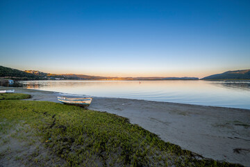 Knysna Lagoon with jetty and fishing boats at sunset in the Garden Route South Africa