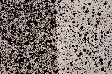 Random watercolor speckle dots. Brush painted stains. Black ink spots on white background.