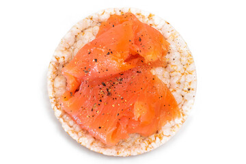 Tasty Rice Cake Sandwich with Fresh Salmon Slices Isolated on White - Top View. Easy Breakfast and...