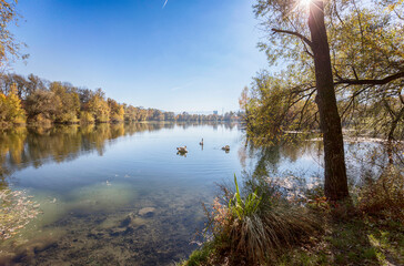 Fototapeta na wymiar green area near Salzburg, autumn park and pond Salzachsee