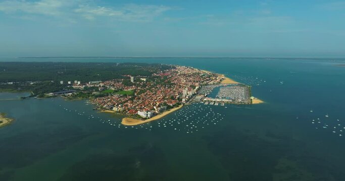 Aerial view of coastal Arcachon city with moored boats. Popular tourist destination for ocean holidays in summer