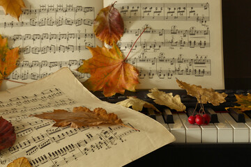 paper music and autumn leaves