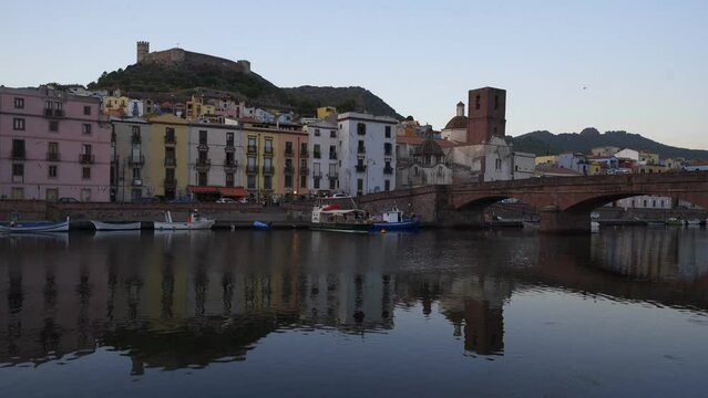 View of Bosa historic colorful city with Temo river at sunset in Sardinia, Italy