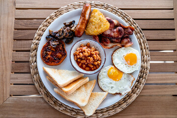 a central overlooking view of a full English style fried breakfast