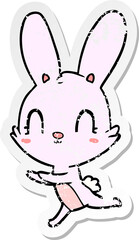 Obraz na płótnie Canvas distressed sticker of a cute cartoon rabbit