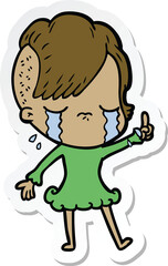 sticker of a cartoon crying girl