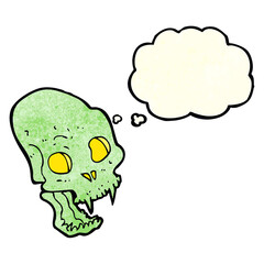 cartoon spooky vampire skull with thought bubble