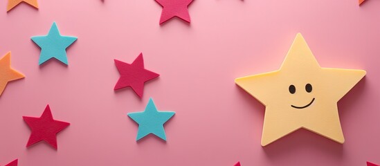 Fototapeta premium Emoji on colorful round paper with grunge star on pink background for positive feedback mental health evaluation child well being concept Copy space image Place for adding text or design