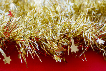 Christmas and New Year background with shiny golden tinsel 