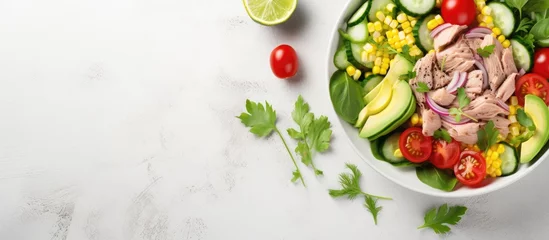 Fotobehang Healthy ketogenic dish Avocado and tuna salad with fresh vegetables Copy space image Place for adding text or design © vxnaghiyev