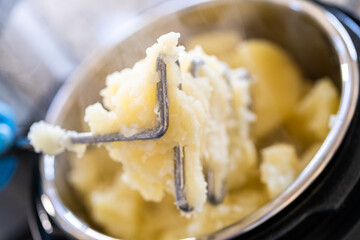 Whipping Up Creamy Mashed Potatoes in Modern Kitchen