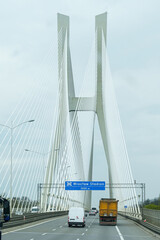 Obraz premium Car traffic on a modern bridge over the Oder River in Wroclaw.