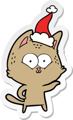hand drawn sticker cartoon of a cat wearing santa hat
