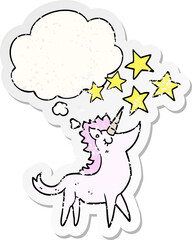 cartoon unicorn with thought bubble as a distressed worn sticker