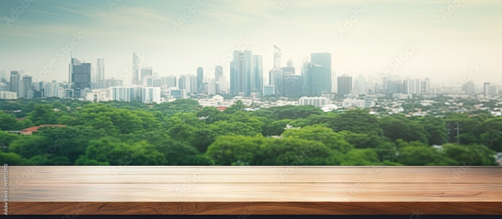 Aufkleber morning city background with blurred window glass garden green and wood table top for product displa