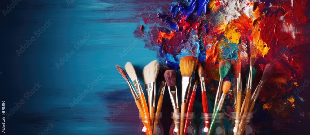 Aufkleber Mixing colors with art brushes during the creative process of painting pictures using different paints and brushes for creativity Copy space image Place for adding text or design