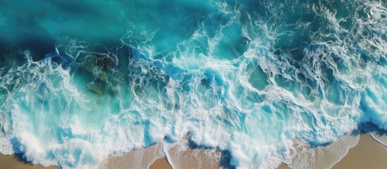 Naklejka premium Ocean Beach drone video captures waves with rocks and foam Copy space image Place for adding text or design