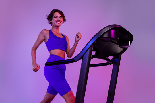 Photo of sporty lady full determination run jogging for sport store shopping offer isolated ultraviolet neon background - Powered by Adobe