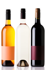 Set of three bottles of wine on white background