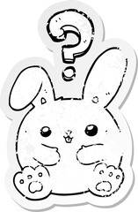 distressed sticker of a cartoon rabbit with question mark