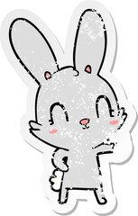 distressed sticker of a cute cartoon rabbit