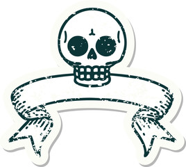 worn old sticker with banner of a skull