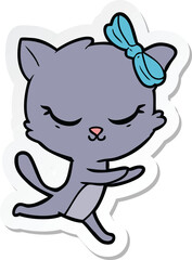 sticker of a cute cartoon cat with bow