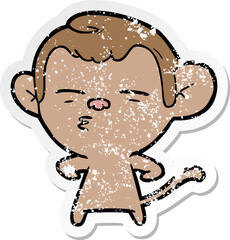 distressed sticker of a cartoon suspicious monkey