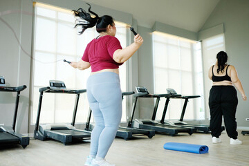 Fototapeta na wymiar young woman jumping rope to exercise Exercise concept to lose weight.
