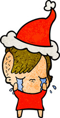 hand drawn textured cartoon of a crying girl wearing santa hat