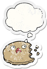cartoon cookie with thought bubble as a distressed worn sticker
