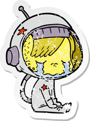 distressed sticker of a cartoon crying astronaut girl sitting
