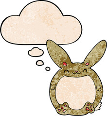 cartoon rabbit with thought bubble in grunge texture style