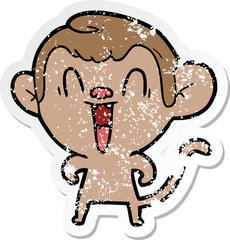 distressed sticker of a cartoon laughing monkey