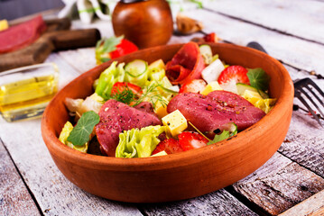 fresh salad with salami and vegetables