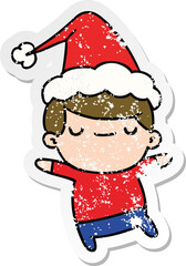 hand drawn christmas distressed sticker cartoon of kawaii boy
