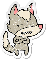 distressed sticker of a cartoon wolf showing teeth